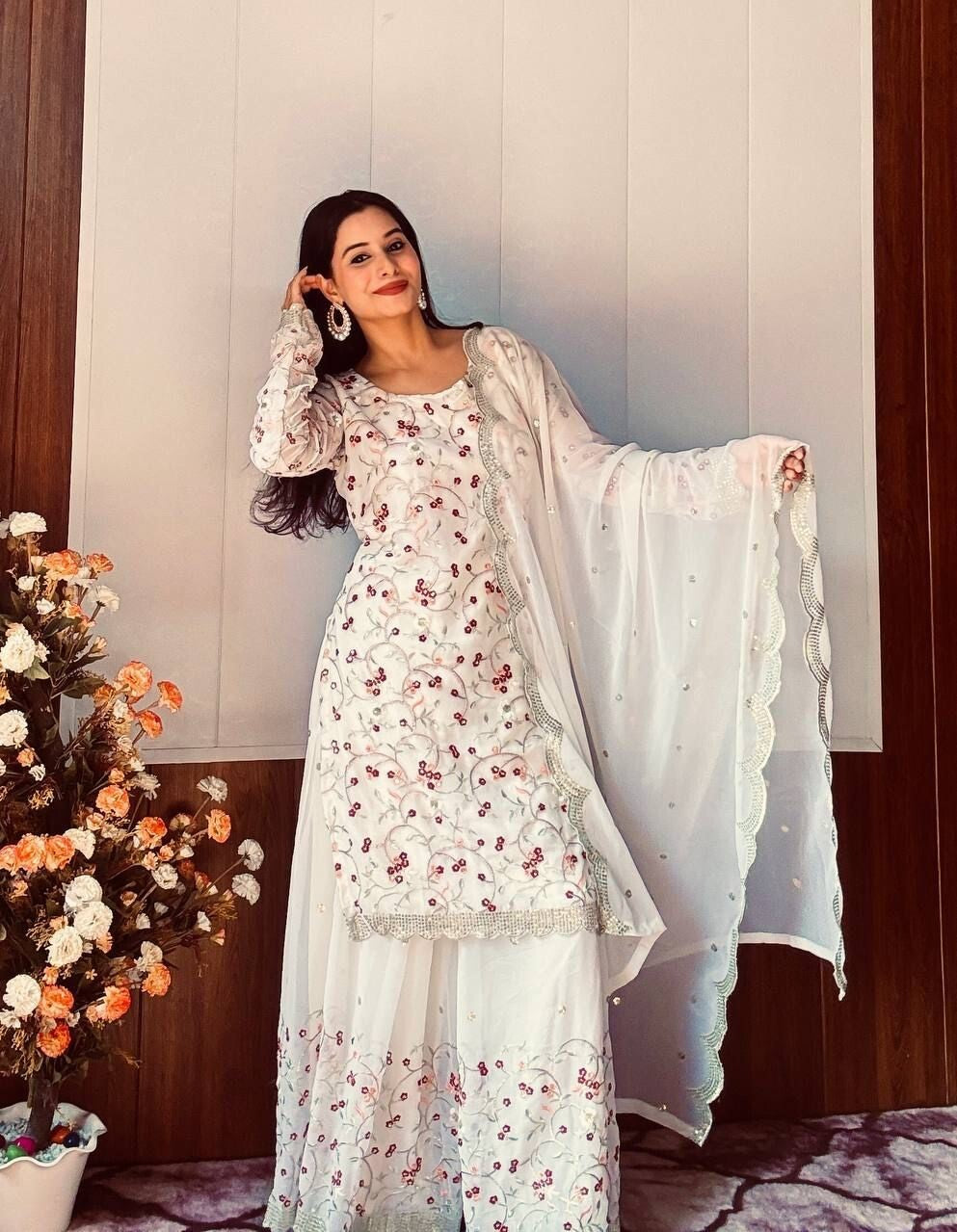 Pakistani Wedding Sharara,
Indian Salwar Kameez Set,
Georgette Sharara Suit,
Off White Sharara Dress,
Sequins and Zari Work Suit,
Wedding Guest Outfit,
Bridal Salwar Kameez,
Scoop Neck Kurta Set,
Full Sleeve Kurti Sharara,
Embroidered Sharara Suit,
Sharara Dress for Reception,
Traditional Wedding Outfit,
Party Wear Salwar Suit,
Elegant Indian Ethnic Wear,
Handmade in India Outfit,
Georgette Dupatta with Sequins,
Long Kurta Sharara Set,
Ready to Wear Sharara Suit,
Zari Embroidery Suit Set,
Flairy Georgette S