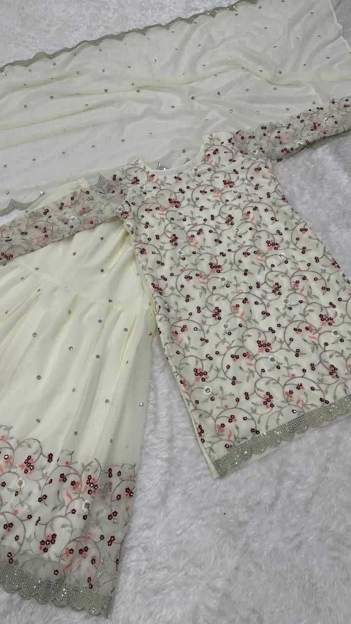 Pakistani Wedding Sharara,
Indian Salwar Kameez Set,
Georgette Sharara Suit,
Off White Sharara Dress,
Sequins and Zari Work Suit,
Wedding Guest Outfit,
Bridal Salwar Kameez,
Scoop Neck Kurta Set,
Full Sleeve Kurti Sharara,
Embroidered Sharara Suit,
Sharara Dress for Reception,
Traditional Wedding Outfit,
Party Wear Salwar Suit,
Elegant Indian Ethnic Wear,
Handmade in India Outfit,
Georgette Dupatta with Sequins,
Long Kurta Sharara Set,
Ready to Wear Sharara Suit,
Zari Embroidery Suit Set,
Flairy Georgette S
