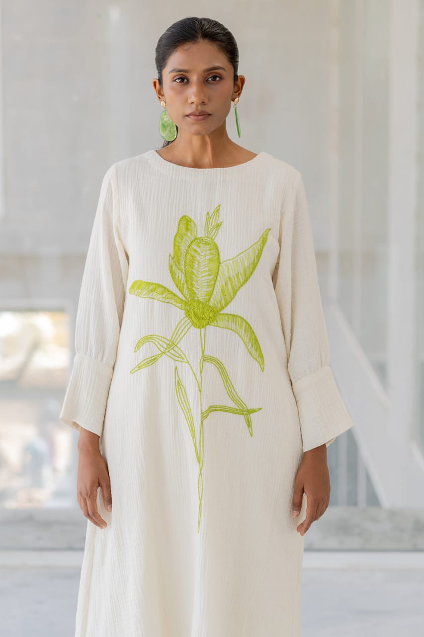 white cotton kurti,white a-line kurti,embroidered white kurti,cotton flex kurta set,green embroidery kurti,stylish white kurta,white kurti with pant,minimalist ethnic wear,modern white kurti,designer cotton kurti,white kurta for women,a-line kurta design,elegant white kurti,white kurti for summer,office wear kurta set,casual white kurti look,indian cotton kurta,pocket pants set,white kurta outfit,hand embroidery kurti,white ethnic dress,women's kurta set,floral embroidered kurti,white kurti with green work,